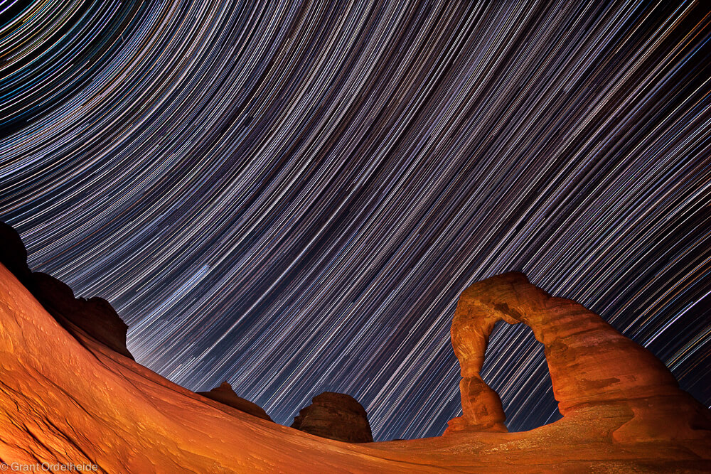 Star trails over Delicate Arch in Utah.