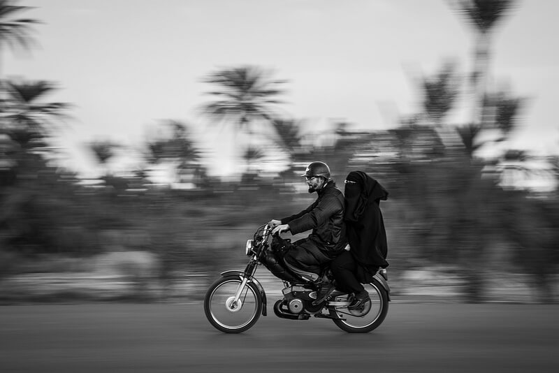 Muslim couple on motorcycle