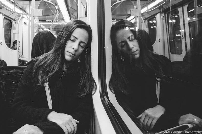 woman sleeping on subway