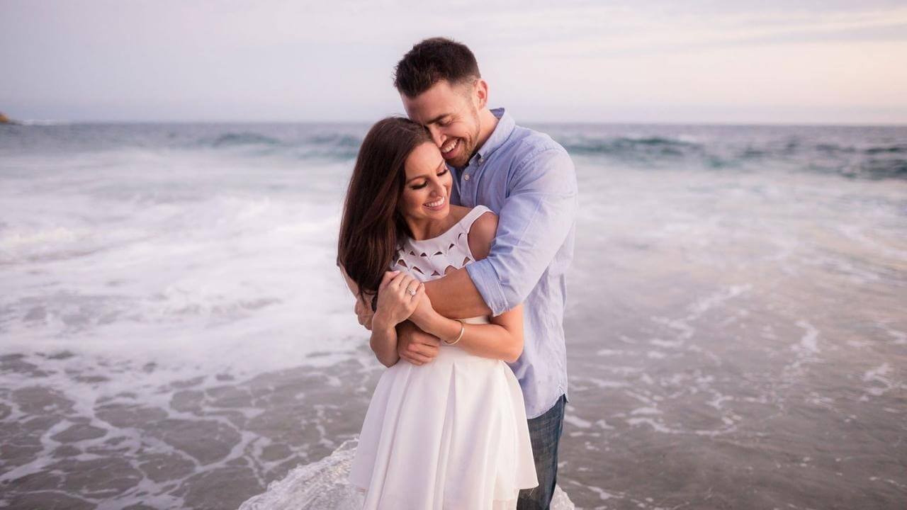 couple posing with hug on beach