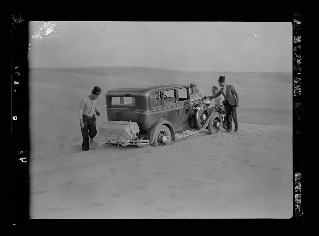 Car stuck in sand dune