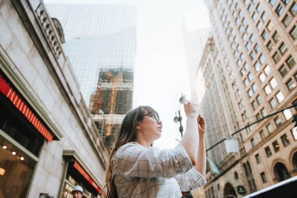 Woman taking a photo in New York City