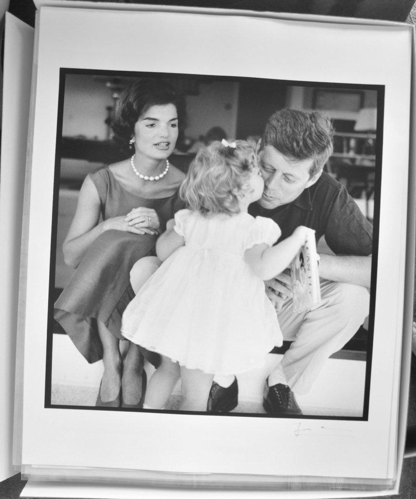 A candid shot of Jacqueline, Caroline, and John F. Kennedy prior to a formal photo shoot for their 1959 Christmas card. © The Estate of Jacques Lowe.