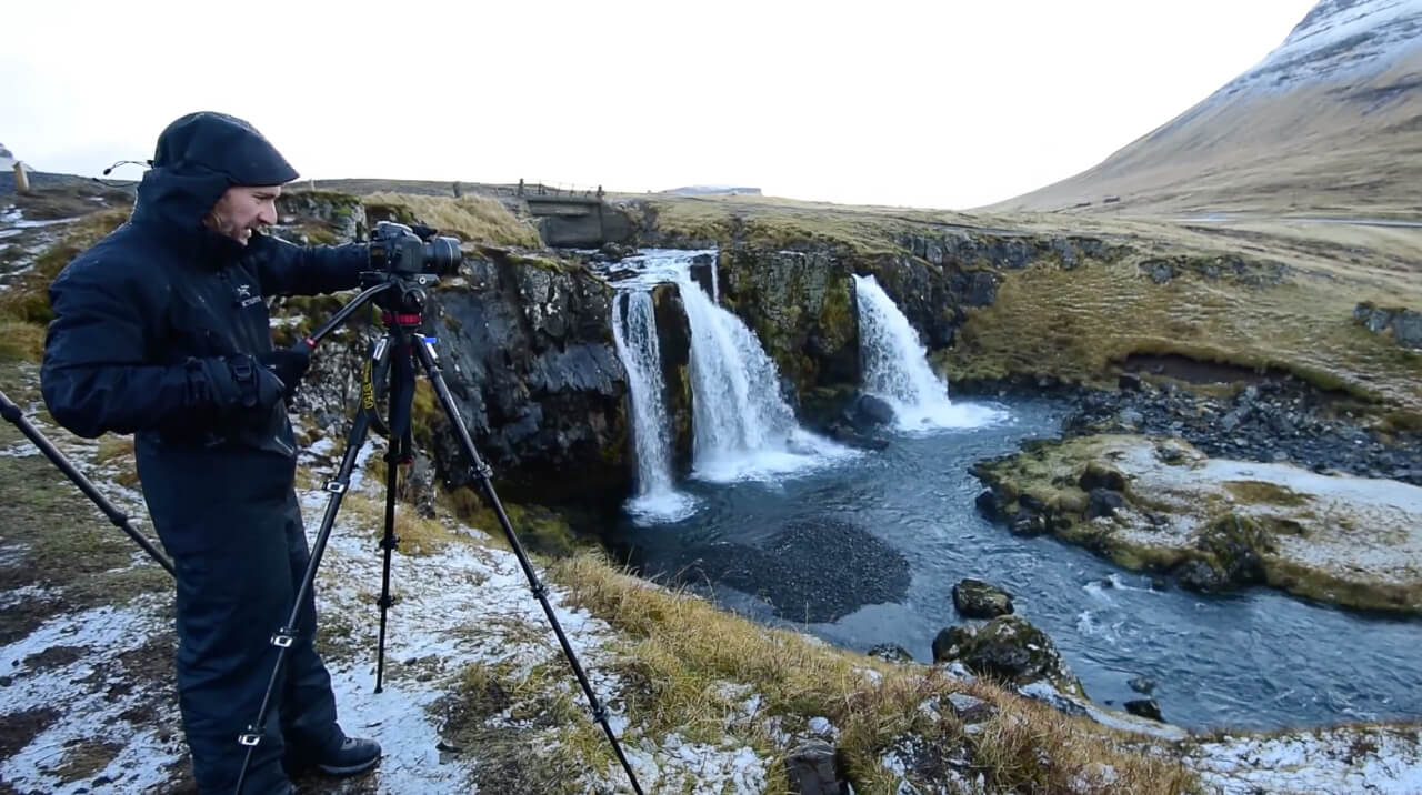 Photographer captures landscape photo near waterfall