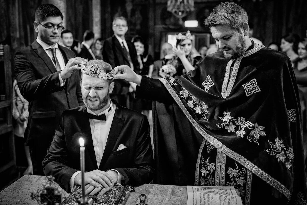 groom at wedding with crown on head